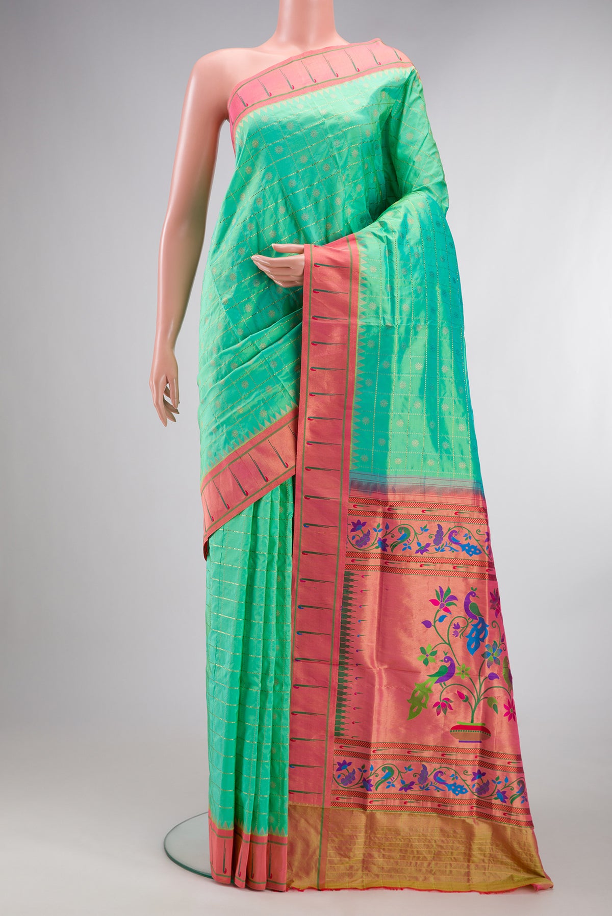Pure Silk Sea Green Dual Tone Paithani Saree with Checked design on the body and Paithani Border.  displayed on a mannequin