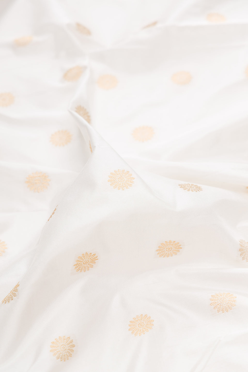 Close up of Pure Silk Off White Paithani Saree with Zari Butta on the body and Paithani Border.  displaying folds