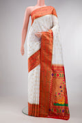 Pure Silk Off White Paithani Saree with Zari Butta on the body and Paithani Border.  displayed on a mannequin