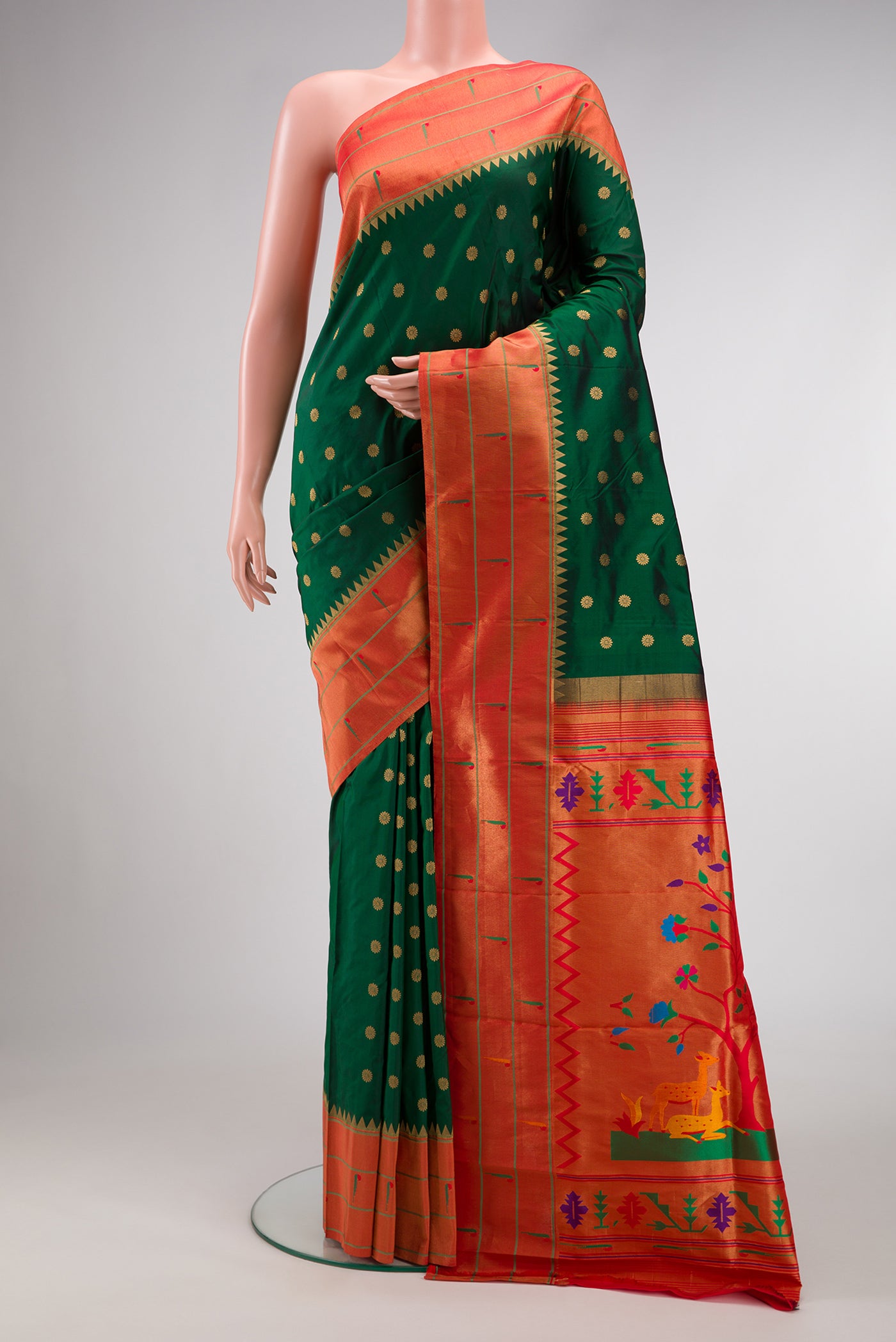 Bottle Green Dual Tone Paithani Silk Saree with Zari Butta on the body and Paithani Border.  displayed on a mannequin