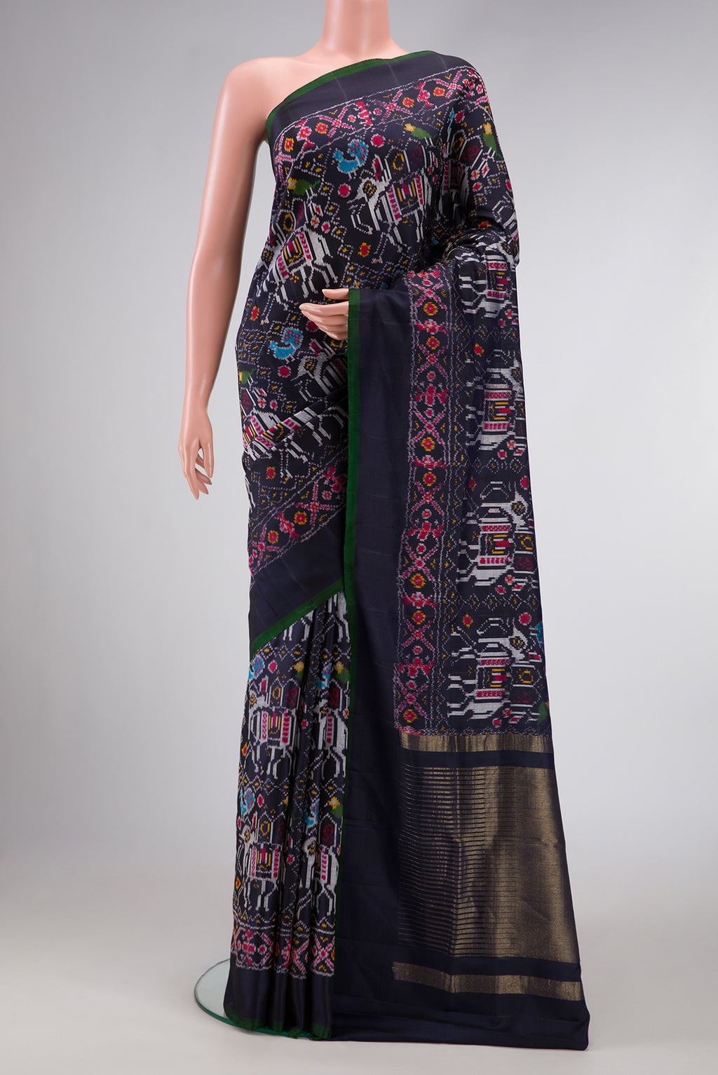 Navy Blue Dual Tone Double Ikat Saree with Ikat Print on the body and Plain Border.  displayed on a mannequin
