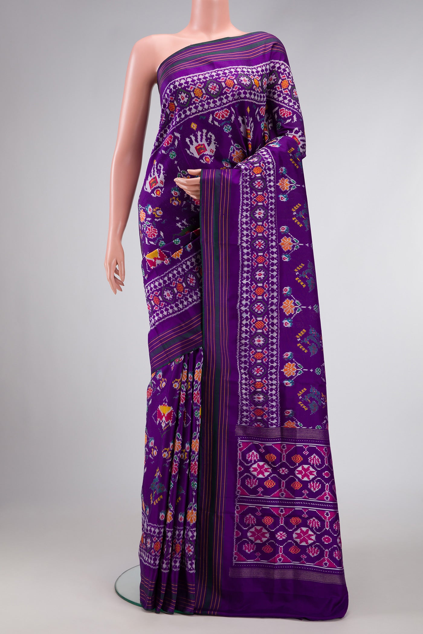 Violet Dual Tone Double Ikat Saree with Ikat Print on the body and Ikat Border.  displayed on a mannequin