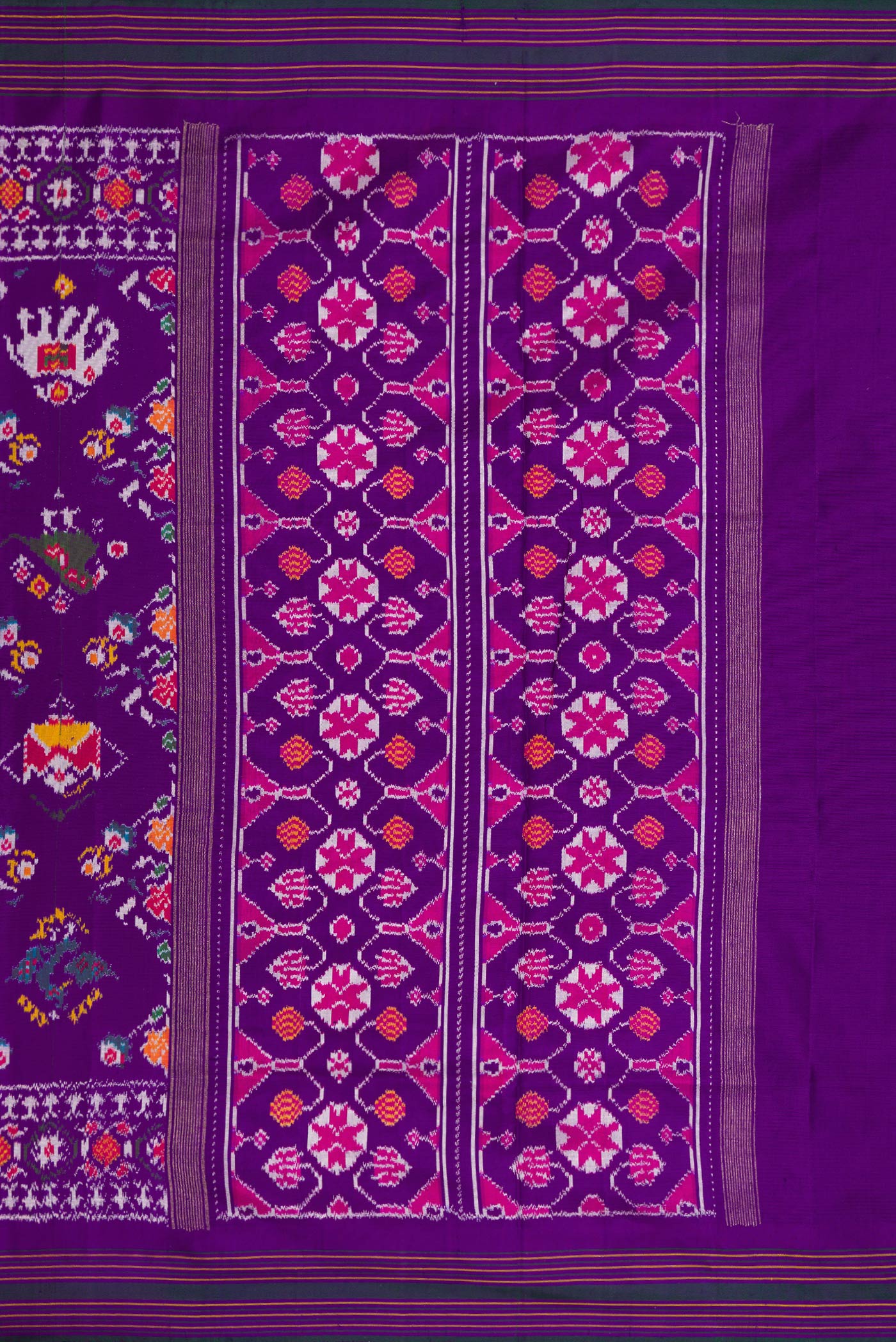 Close up image of the pallu of Violet Dual Tone Double Ikat Saree with Ikat Print on the body and Ikat Border. 