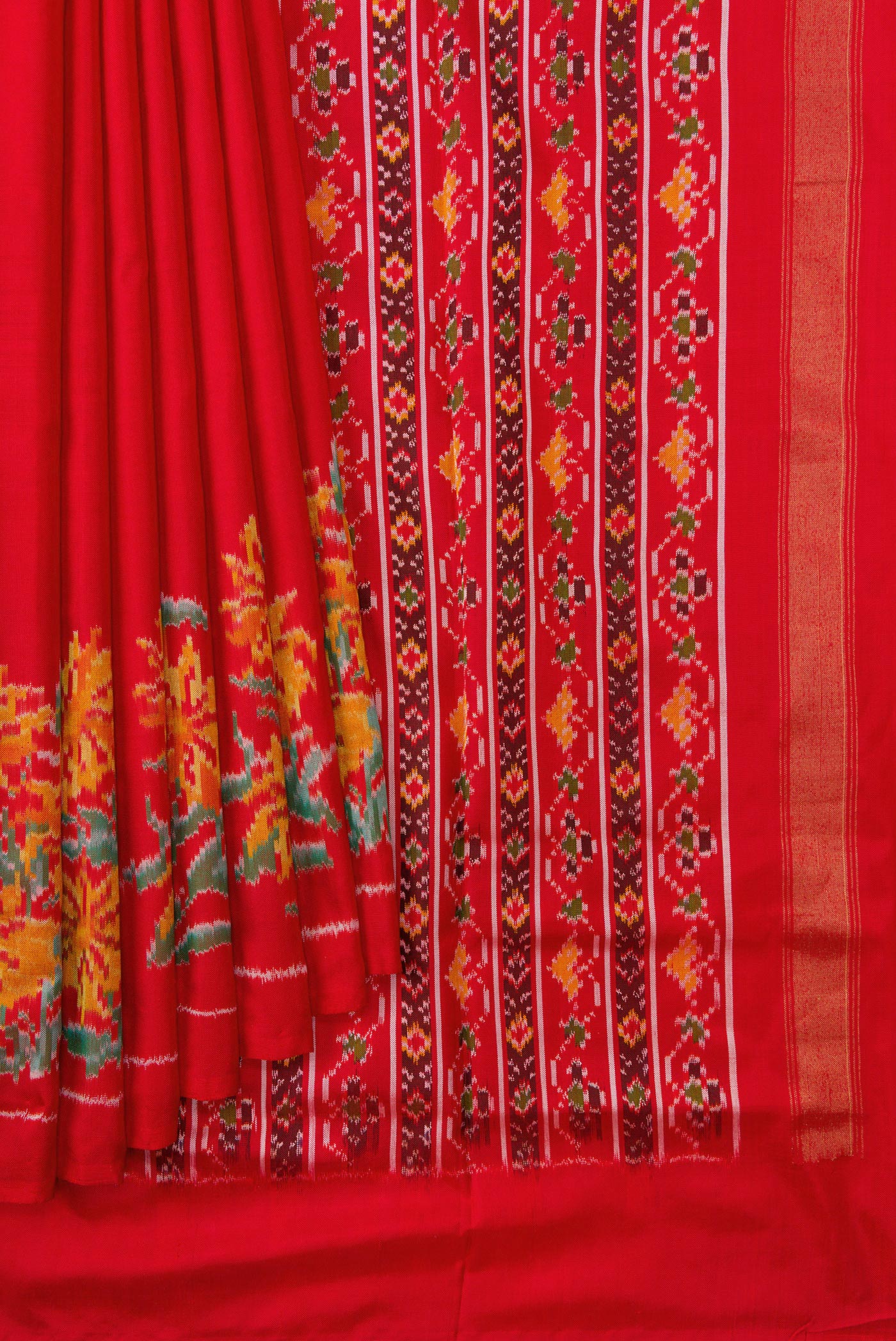 Pleats and pallu of Red Dual Tone Double Ikat Saree with Plain Body and Ikat Border. 