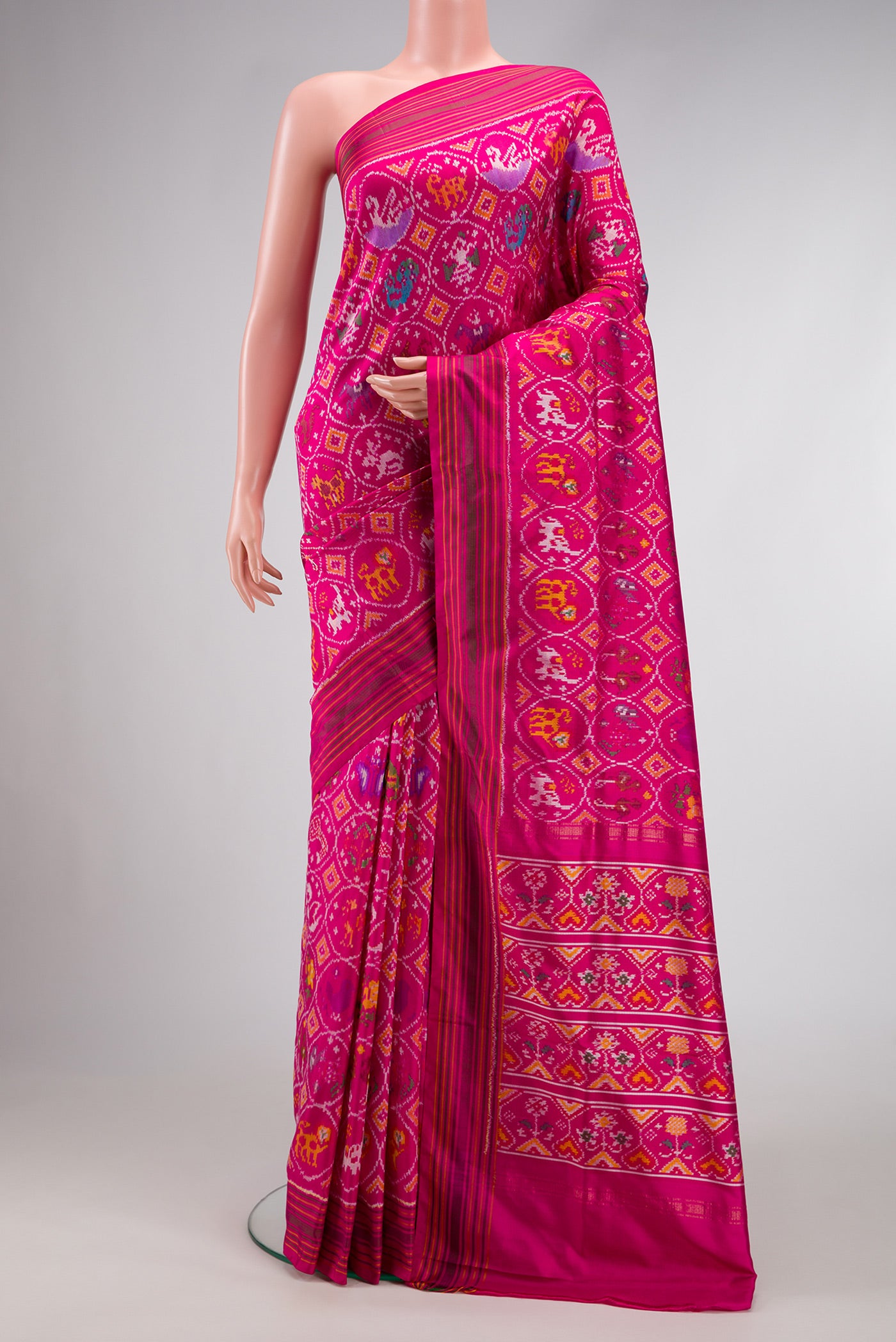 Pink Dual Tone Double Ikat Saree with Ikat Print on the body and Ikat Border.  displayed on a mannequin