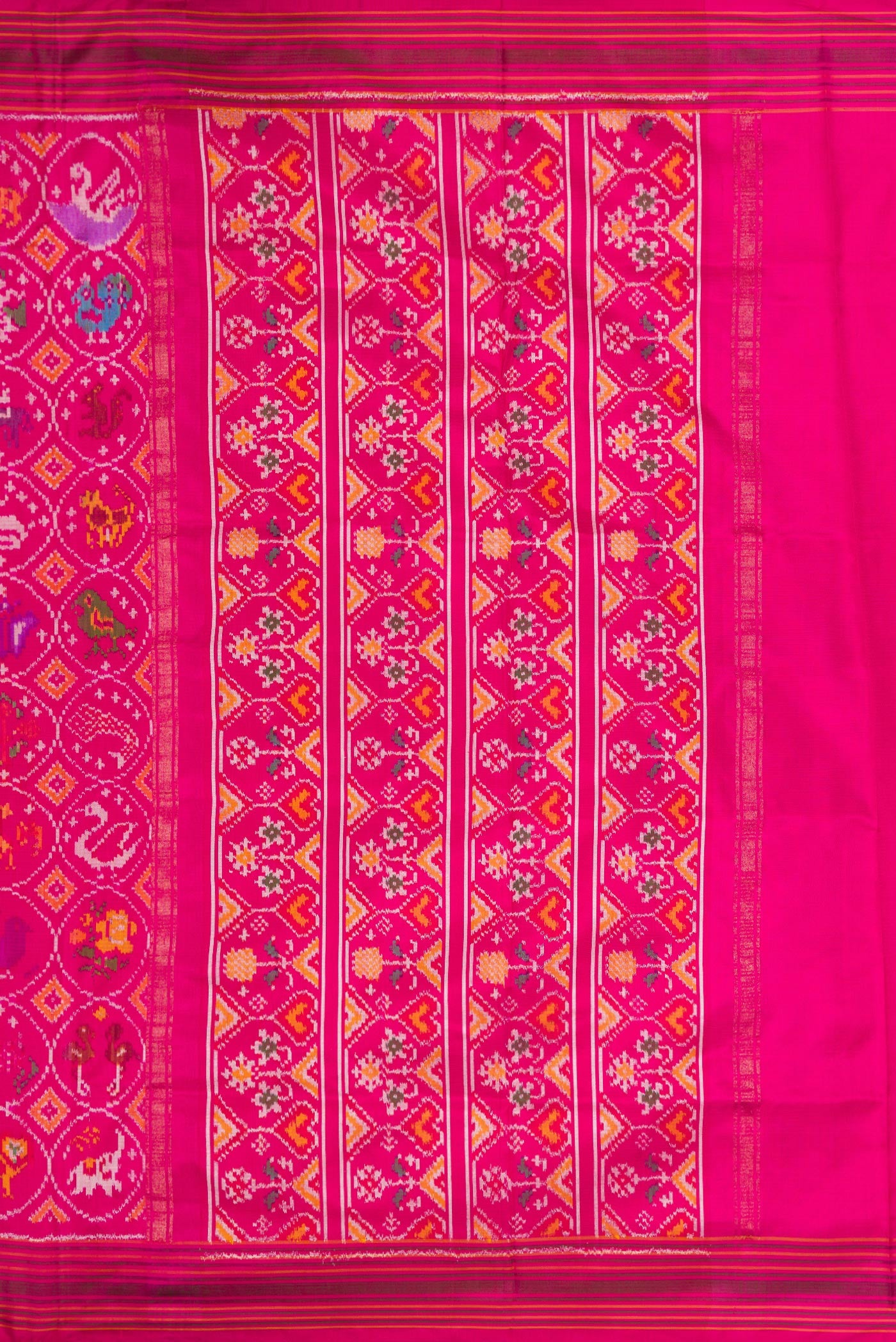 Close up image of the pallu of Pink Dual Tone Double Ikat Saree with Ikat Print on the body and Ikat Border. 