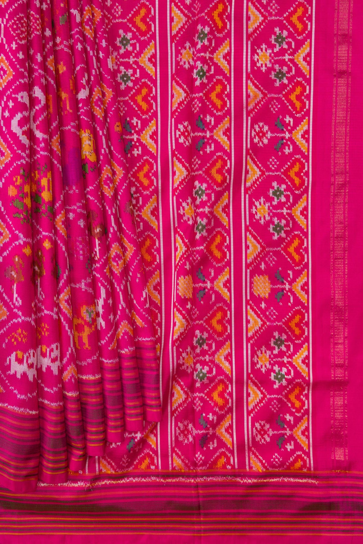 Pleats and pallu of Pink Dual Tone Double Ikat Saree with Ikat Print on the body and Ikat Border. 