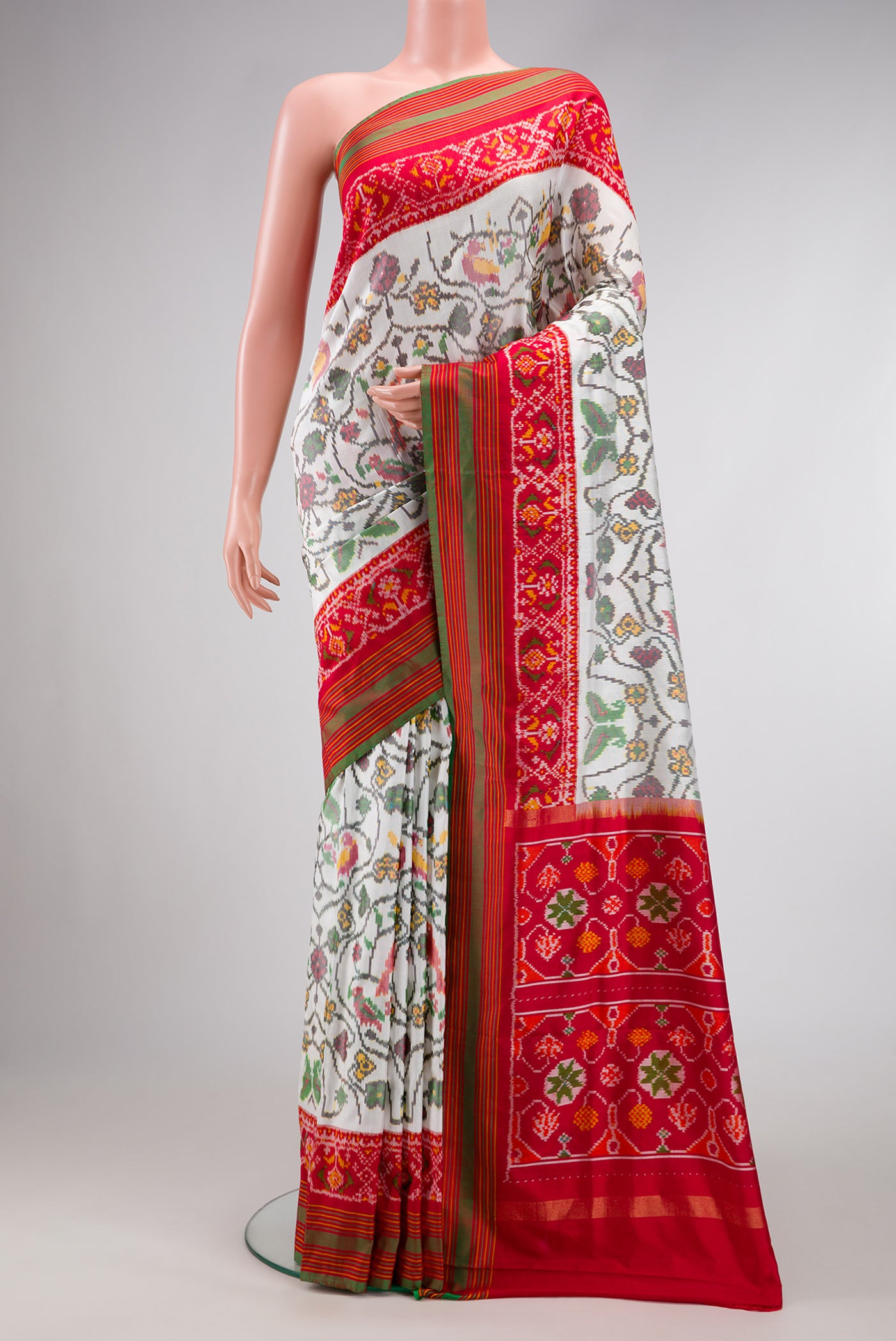 Off White Dual Tone Double Ikat Saree with Ikat Print on the body and Ikat Border.  displayed on a mannequin