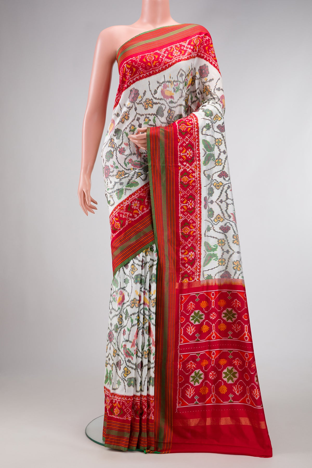 Off White Dual Tone Double Ikat Saree with Ikat Print on the body and Ikat Border.  displayed on a mannequin
