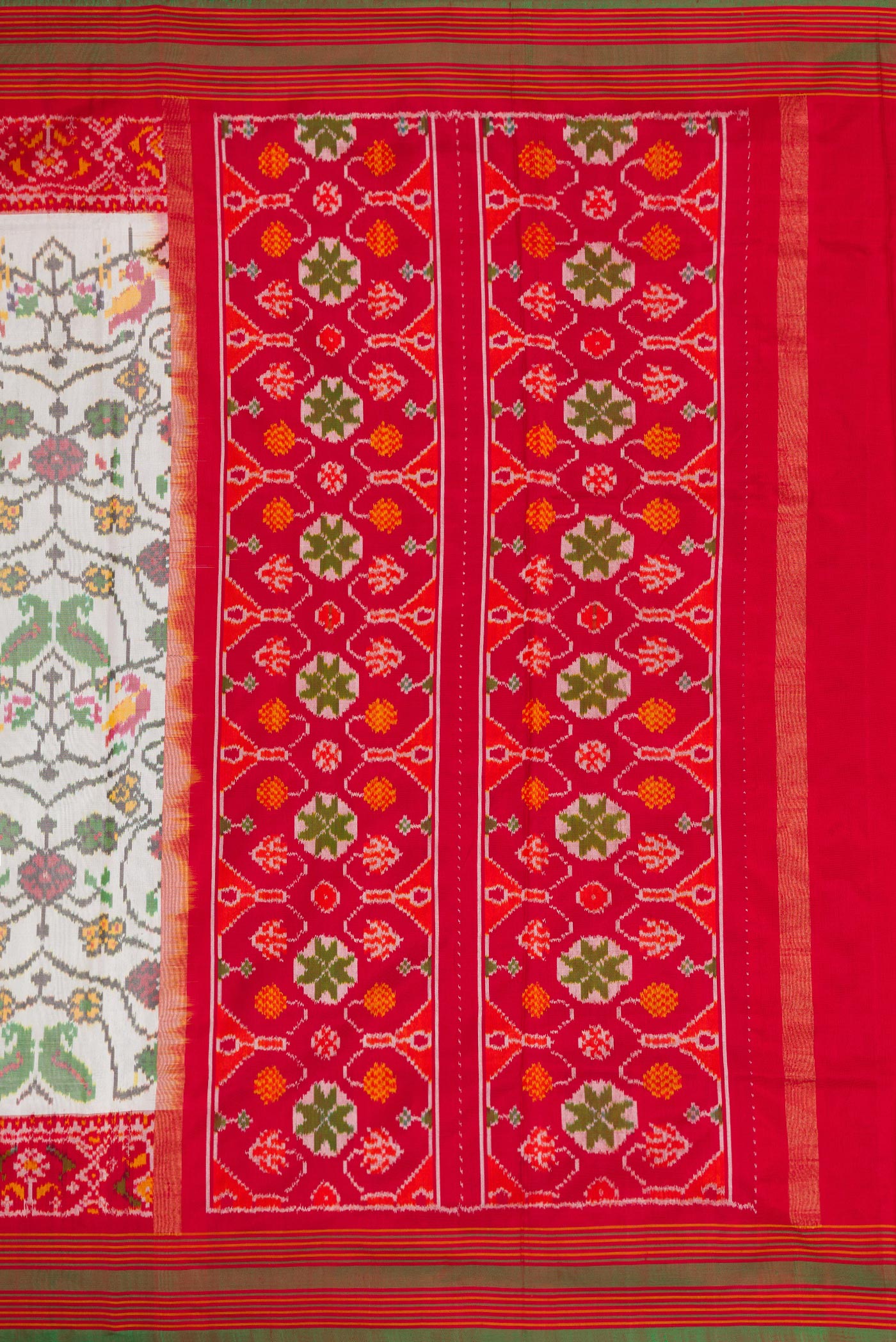 Close up image of the pallu of Off White Dual Tone Double Ikat Saree with Ikat Print on the body and Ikat Border. 