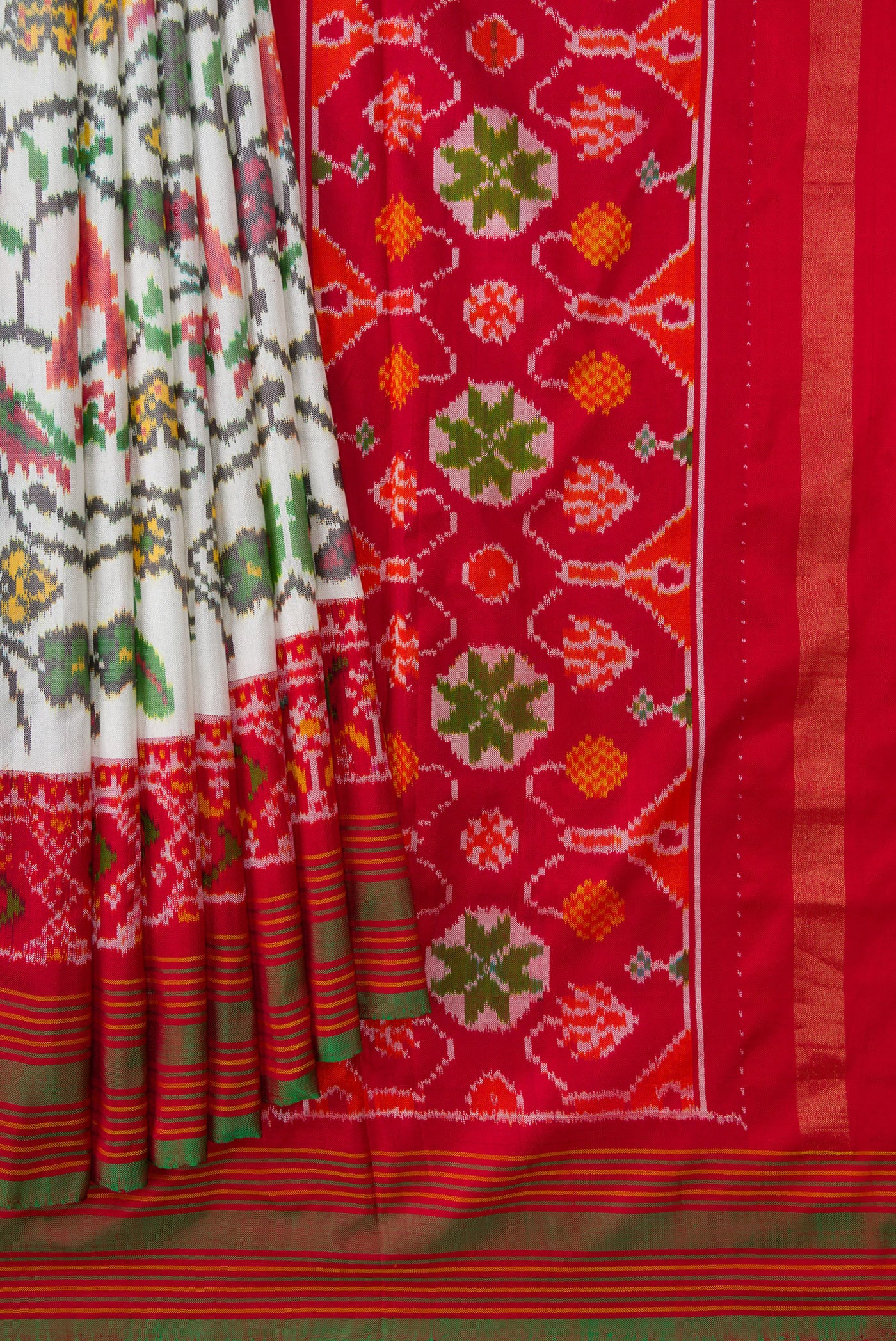 Pleats and pallu of Off White Dual Tone Double Ikat Saree with Ikat Print on the body and Ikat Border. 