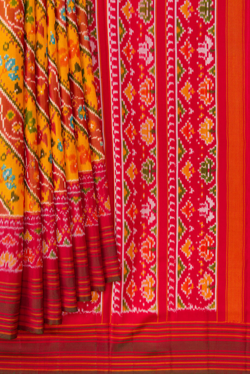 Pleats and pallu of Mustard Dual Tone Double Ikat Saree with Ikat Print on the body and Ikat Border. 