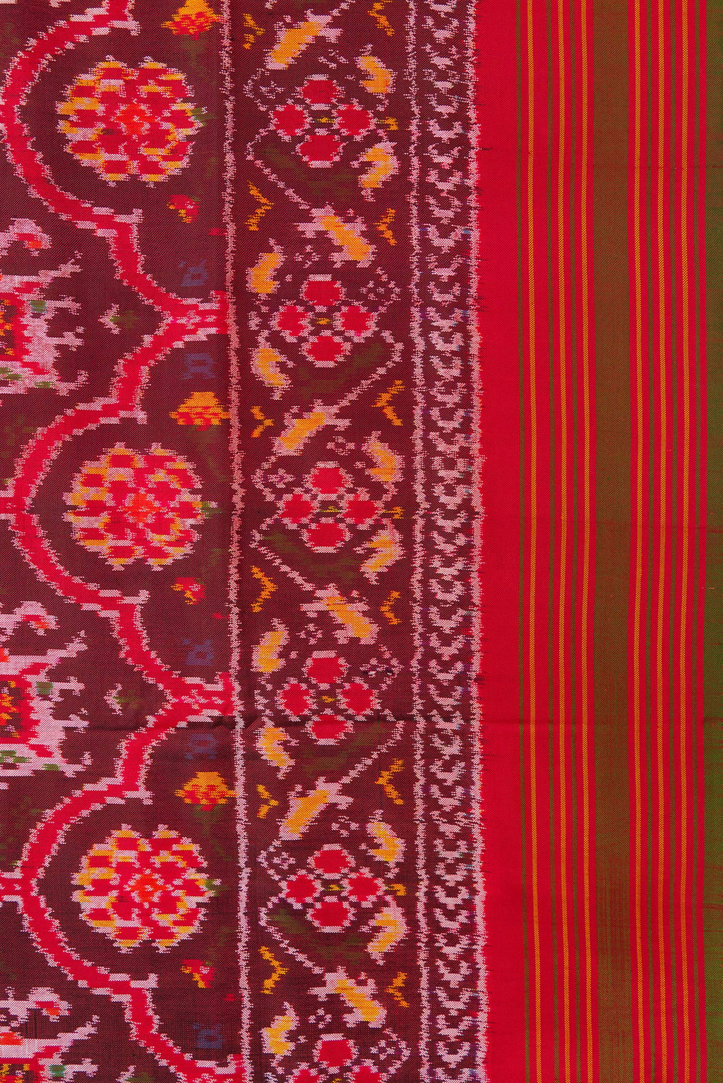 Border image of Maroon Dual Tone Double Ikat Saree with Ikat Print on the body and Zari Border. 
