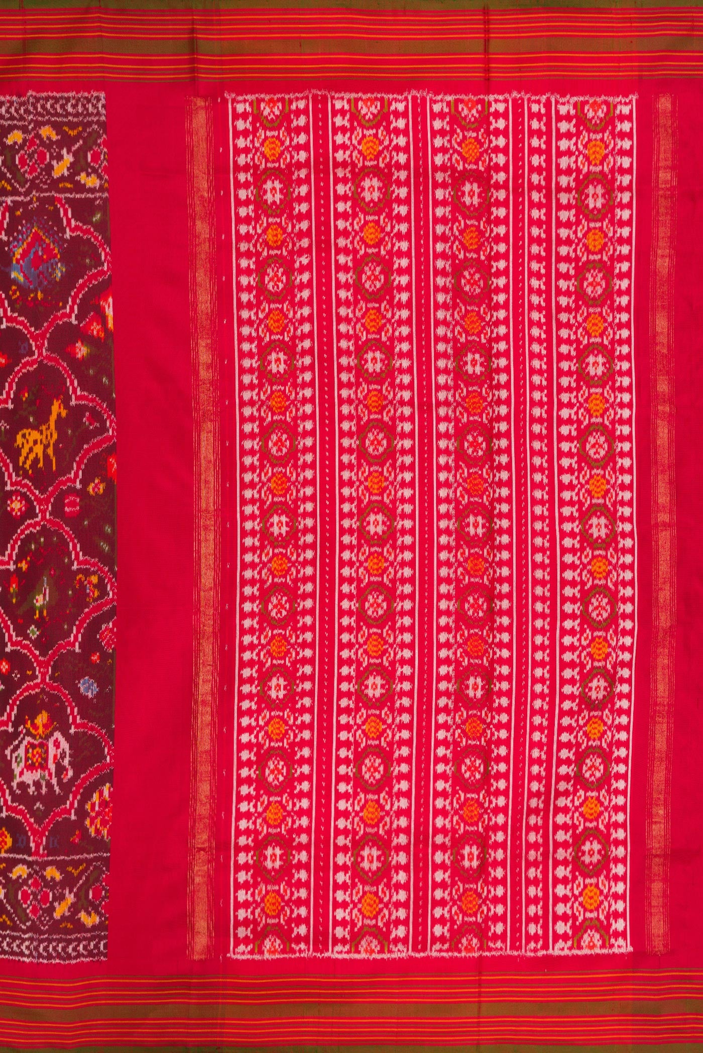 Close up image of the pallu of Maroon Dual Tone Double Ikat Saree with Ikat Print on the body and Zari Border. 