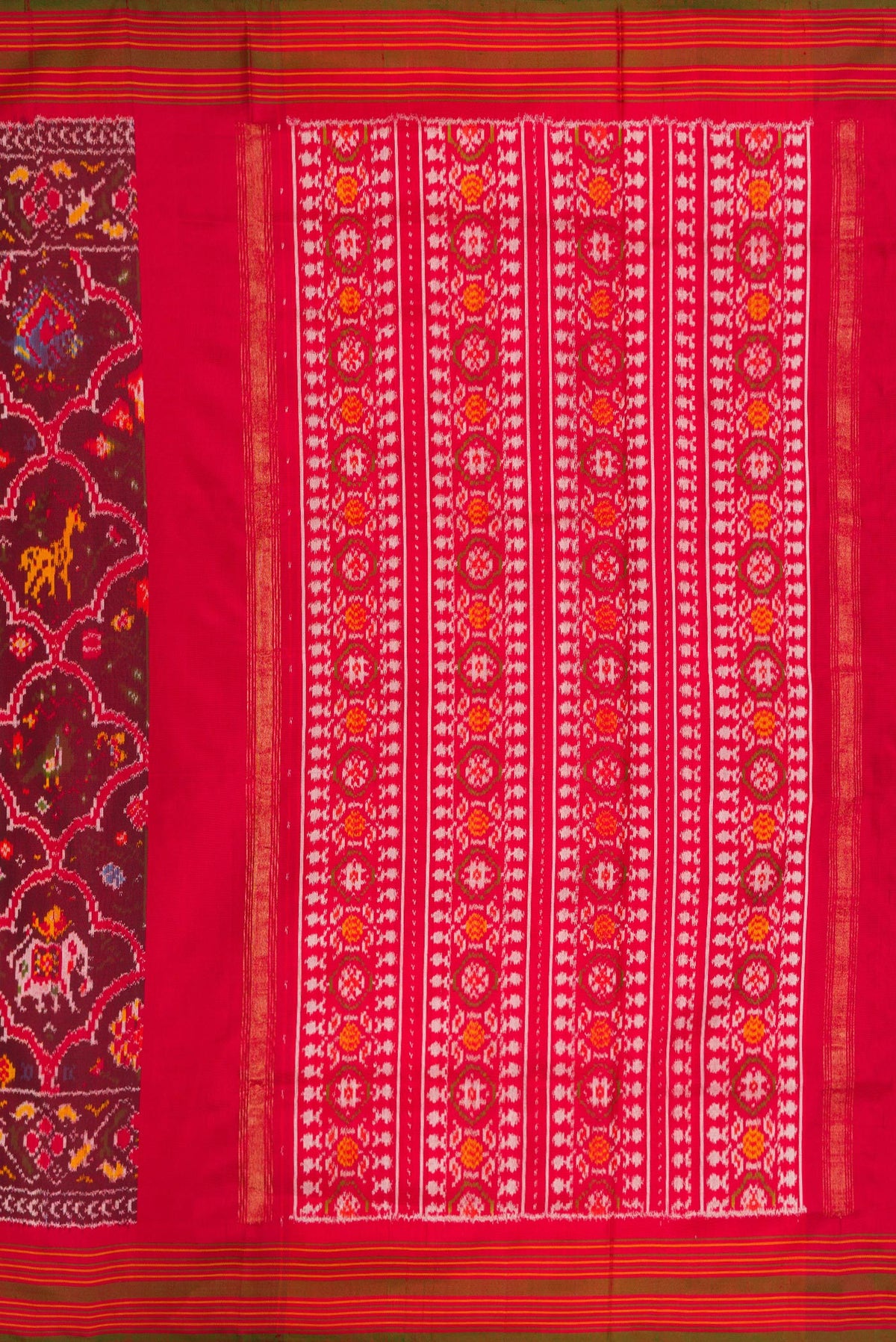 Close up image of the pallu of Maroon Dual Tone Double Ikat Saree with Ikat Print on the body and Zari Border. 