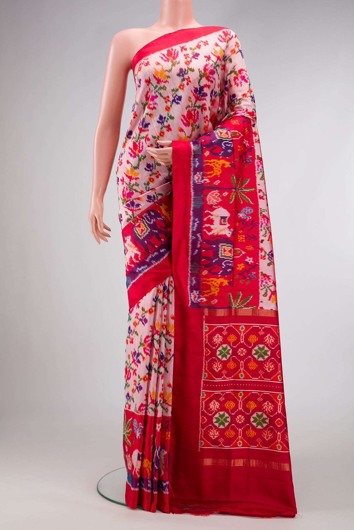 Pink Dual Tone Double Ikat Saree with Ikat Print on the body and Ikat Border.  displayed on a mannequin