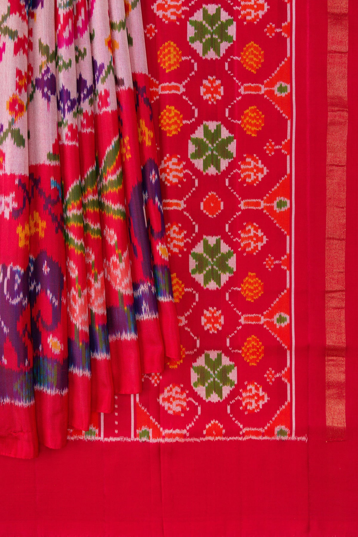 Pleats and pallu of Pink Dual Tone Double Ikat Saree with Ikat Print on the body and Ikat Border. 