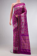 Purple Dual Tone Double Ikat Saree with Ikat Print on the body and Zari Border.  displayed on a mannequin