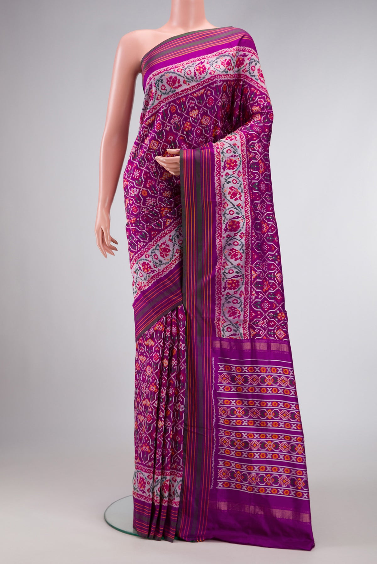 Purple Dual Tone Double Ikat Saree with Ikat Print on the body and Zari Border.  displayed on a mannequin