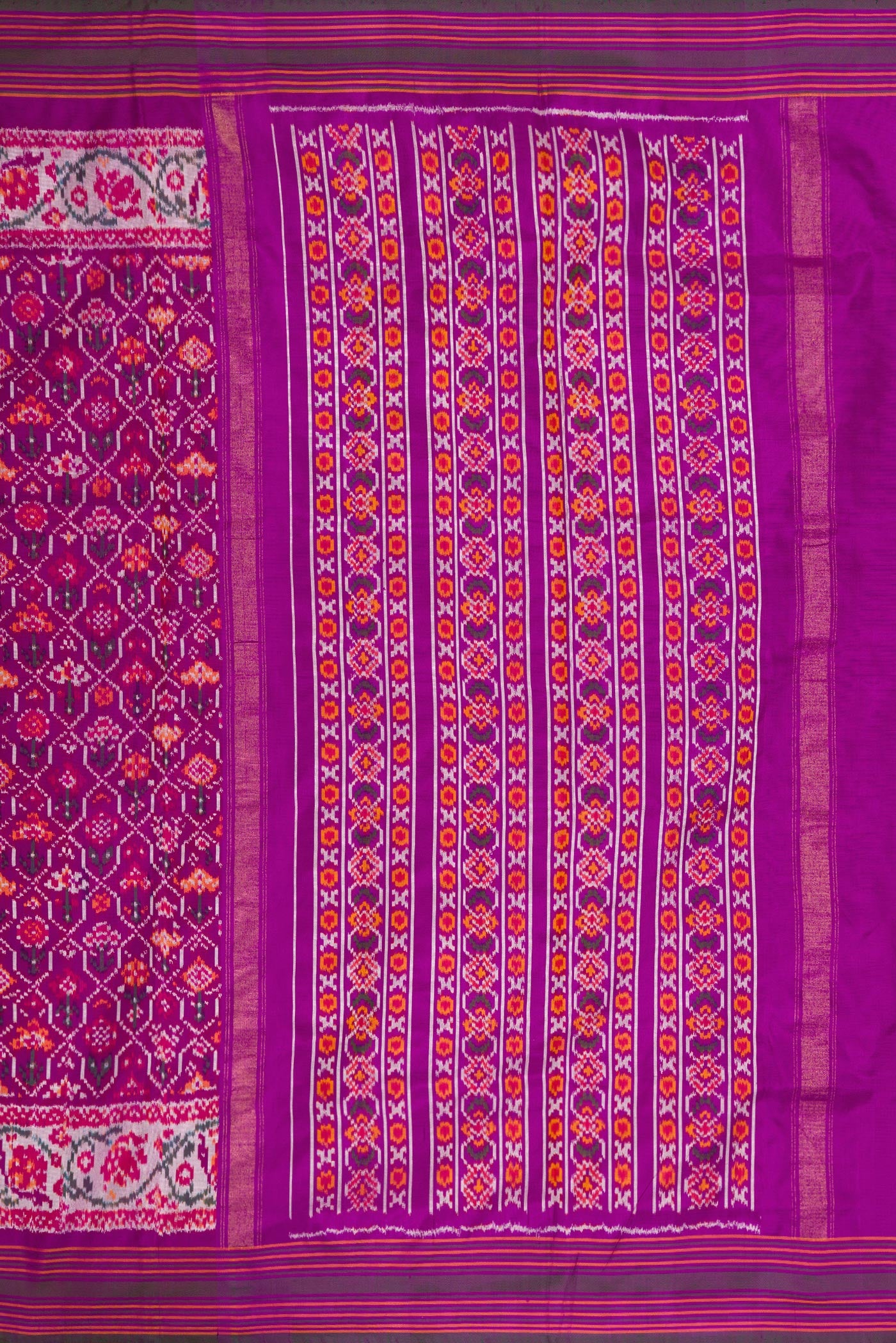 Close up image of the pallu of Purple Dual Tone Double Ikat Saree with Ikat Print on the body and Zari Border. 