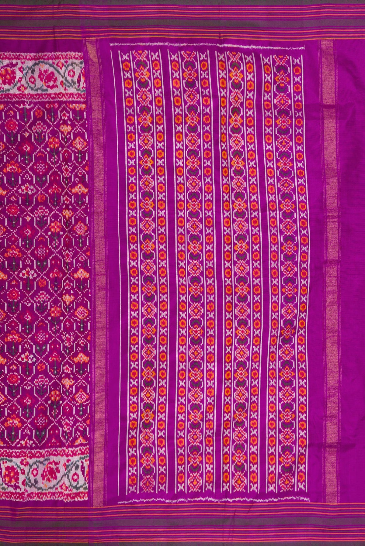 Close up image of the pallu of Purple Dual Tone Double Ikat Saree with Ikat Print on the body and Zari Border. 