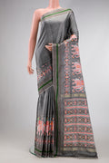 Grey Dual Tone Double Ikat Saree with Ikat Print on the body and Ikat Border.  displayed on a mannequin
