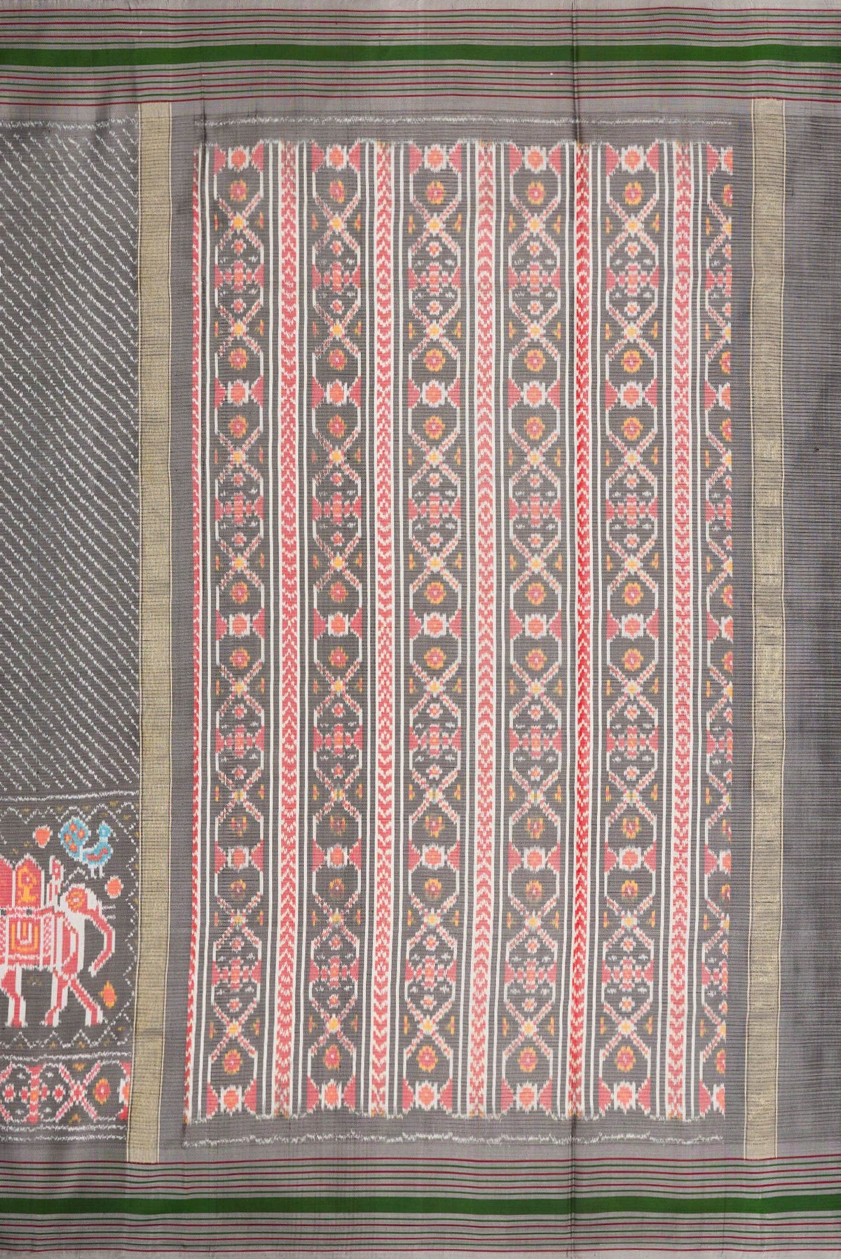 Close up image of the pallu of Grey Dual Tone Double Ikat Saree with Ikat Print on the body and Ikat Border. 
