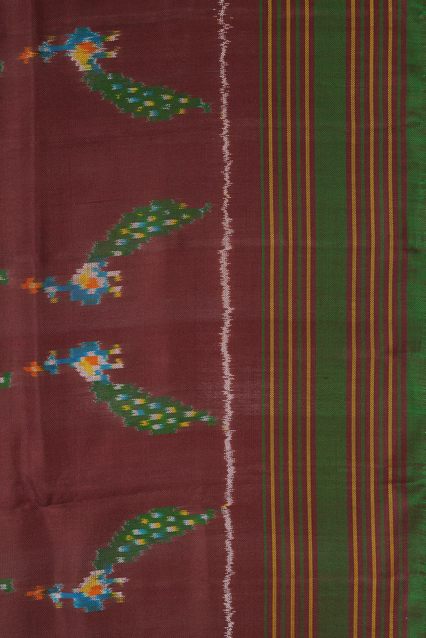 Border image of Brown Dual Tone Double Ikat Saree with Ikat Print on the body and Thread Border. 