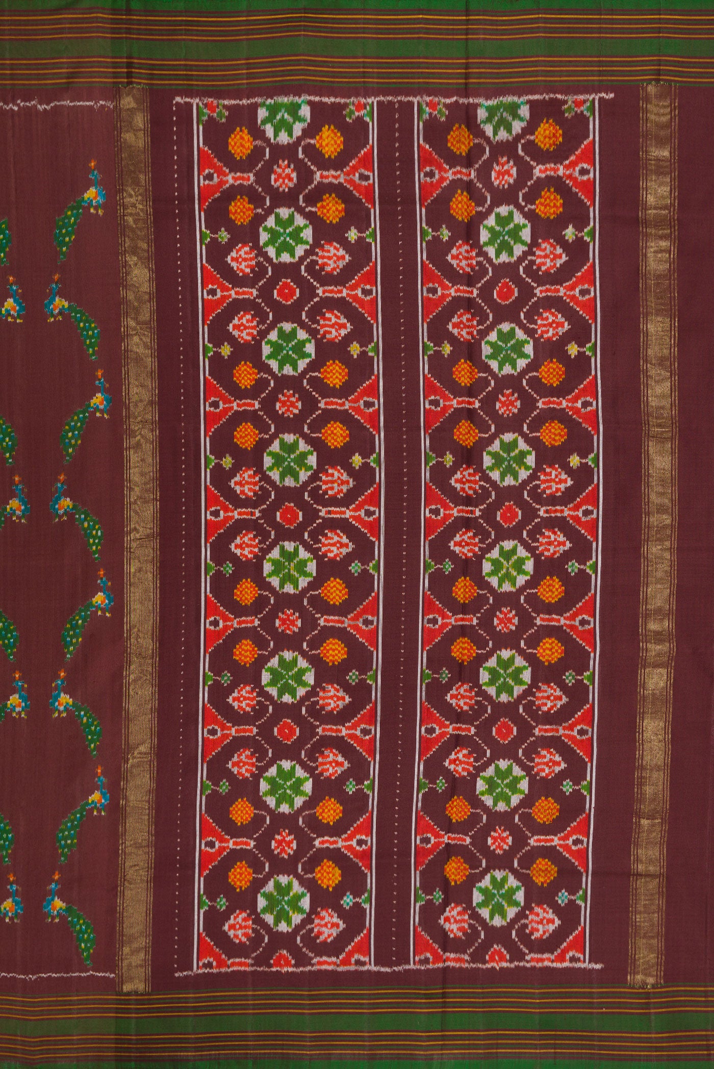 Close up image of the pallu of Brown Dual Tone Double Ikat Saree with Ikat Print on the body and Thread Border. 