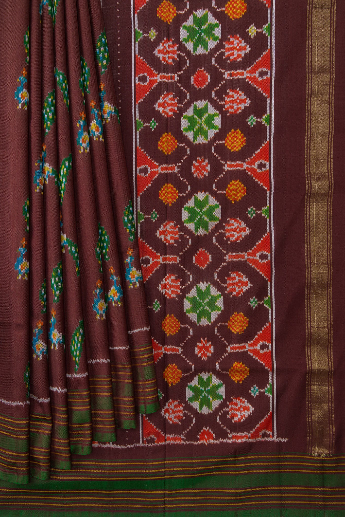 Pleats and pallu of Brown Dual Tone Double Ikat Saree with Ikat Print on the body and Thread Border. 