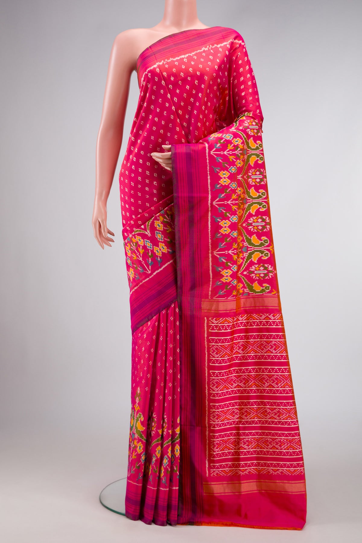 Pink Dual Tone Double Ikat Saree with Ikat Print on the body and Ikat Border.  displayed on a mannequin