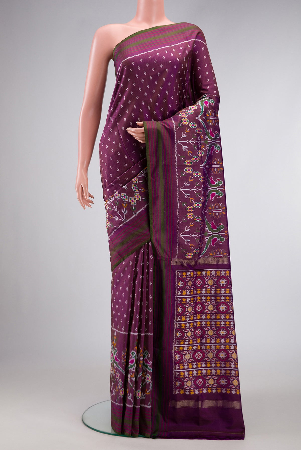 Purple Dual Tone Double Ikat Saree with Ikat Print on the body and Zari Border.  displayed on a mannequin