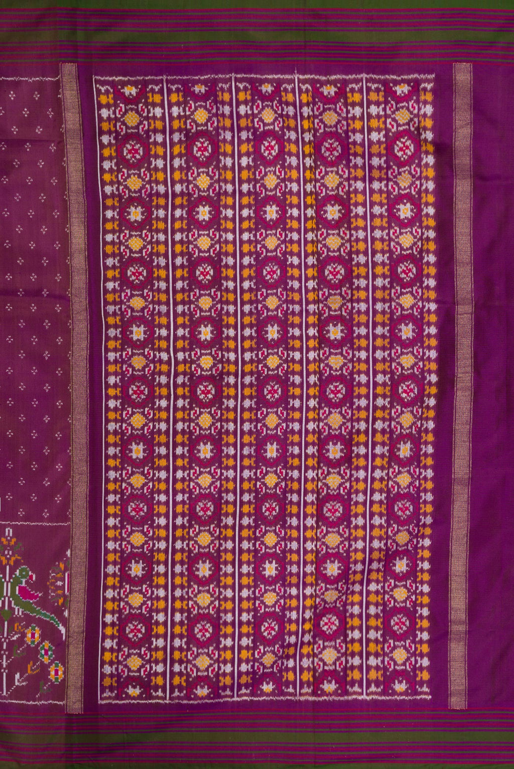 Close up image of the pallu of Purple Dual Tone Double Ikat Saree with Ikat Print on the body and Zari Border. 