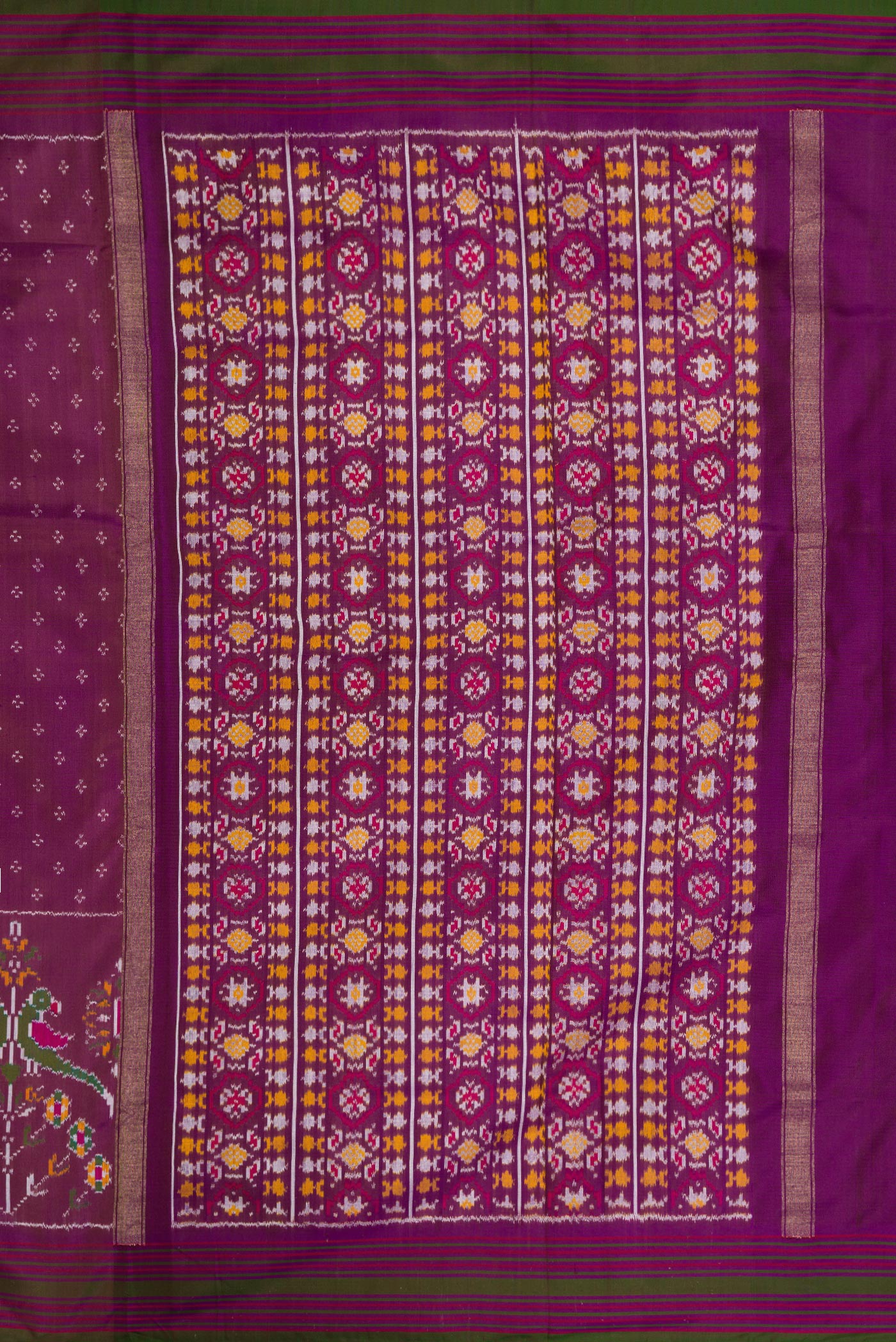 Close up image of the pallu of Purple Dual Tone Double Ikat Saree with Ikat Print on the body and Zari Border. 