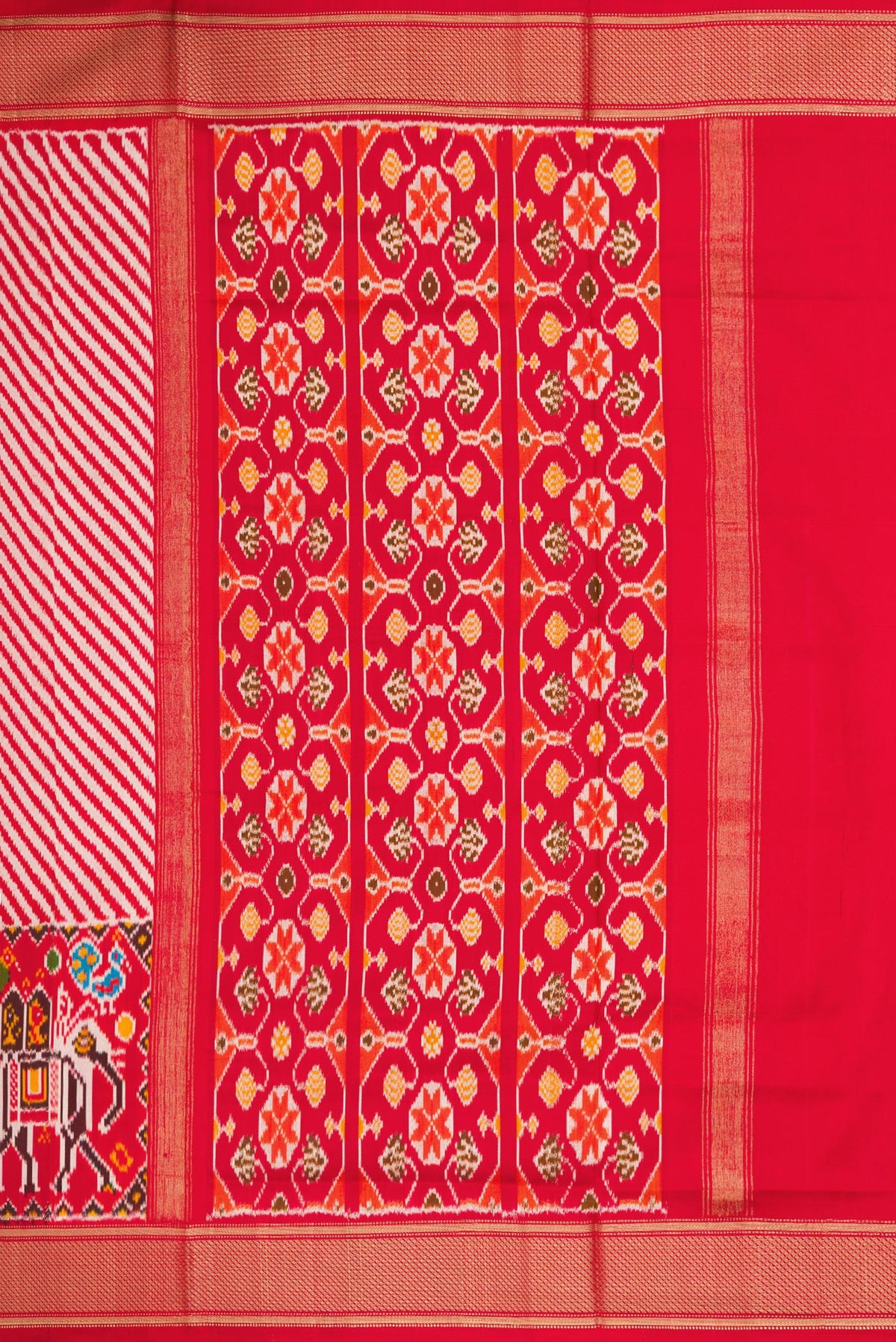 Close up image of the pallu of Red Dual Tone Double Ikat Saree with Ikat Print on the body and Zari Border. 