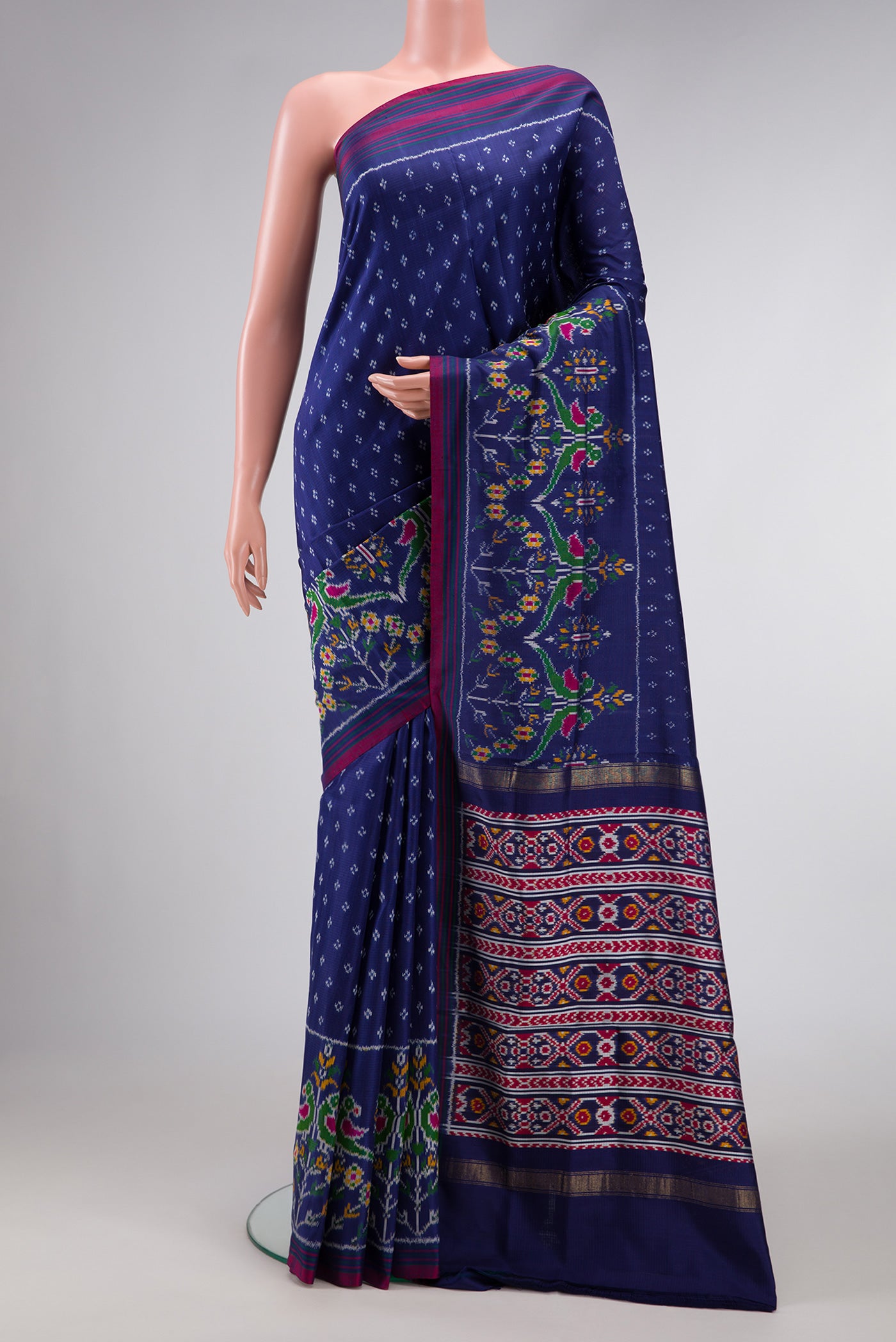 Navy Blue Dual Tone Double Ikat Saree with Ikat Print on the body and Ikat Border.  displayed on a mannequin