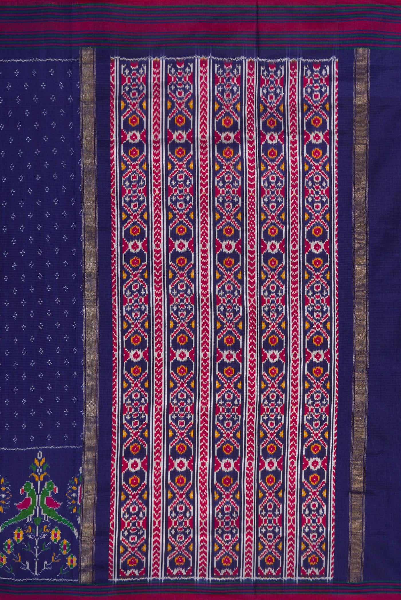 Close up image of the pallu of Navy Blue Dual Tone Double Ikat Saree with Ikat Print on the body and Ikat Border. 