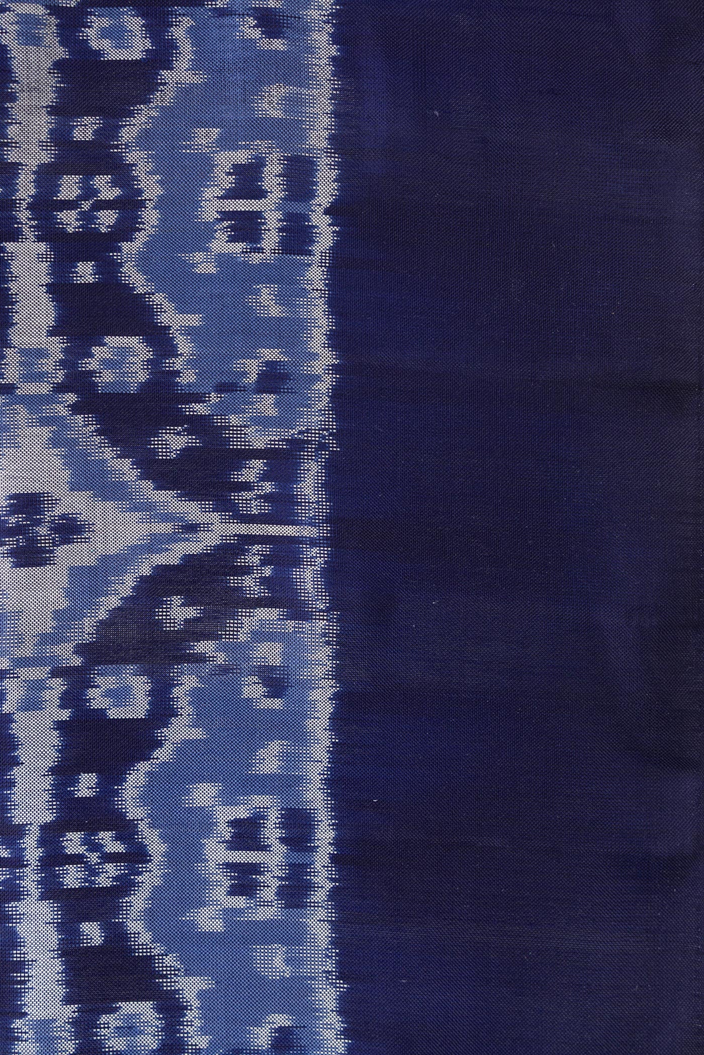 Border image of Navy Blue Dual Tone Double Ikat Saree with Ikat Print on the body and Plain Border. 