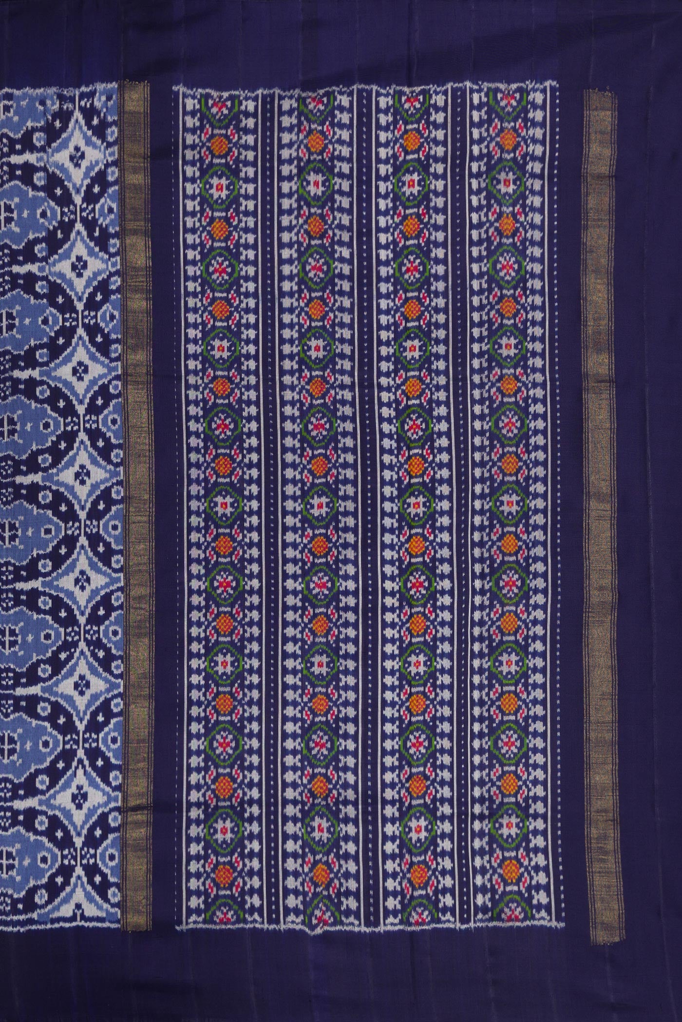 Close up image of the pallu of Navy Blue Dual Tone Double Ikat Saree with Ikat Print on the body and Plain Border. 