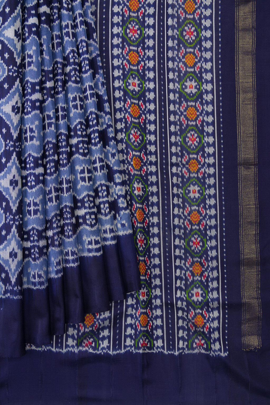 Pleats and pallu of Navy Blue Dual Tone Double Ikat Saree with Ikat Print on the body and Plain Border. 