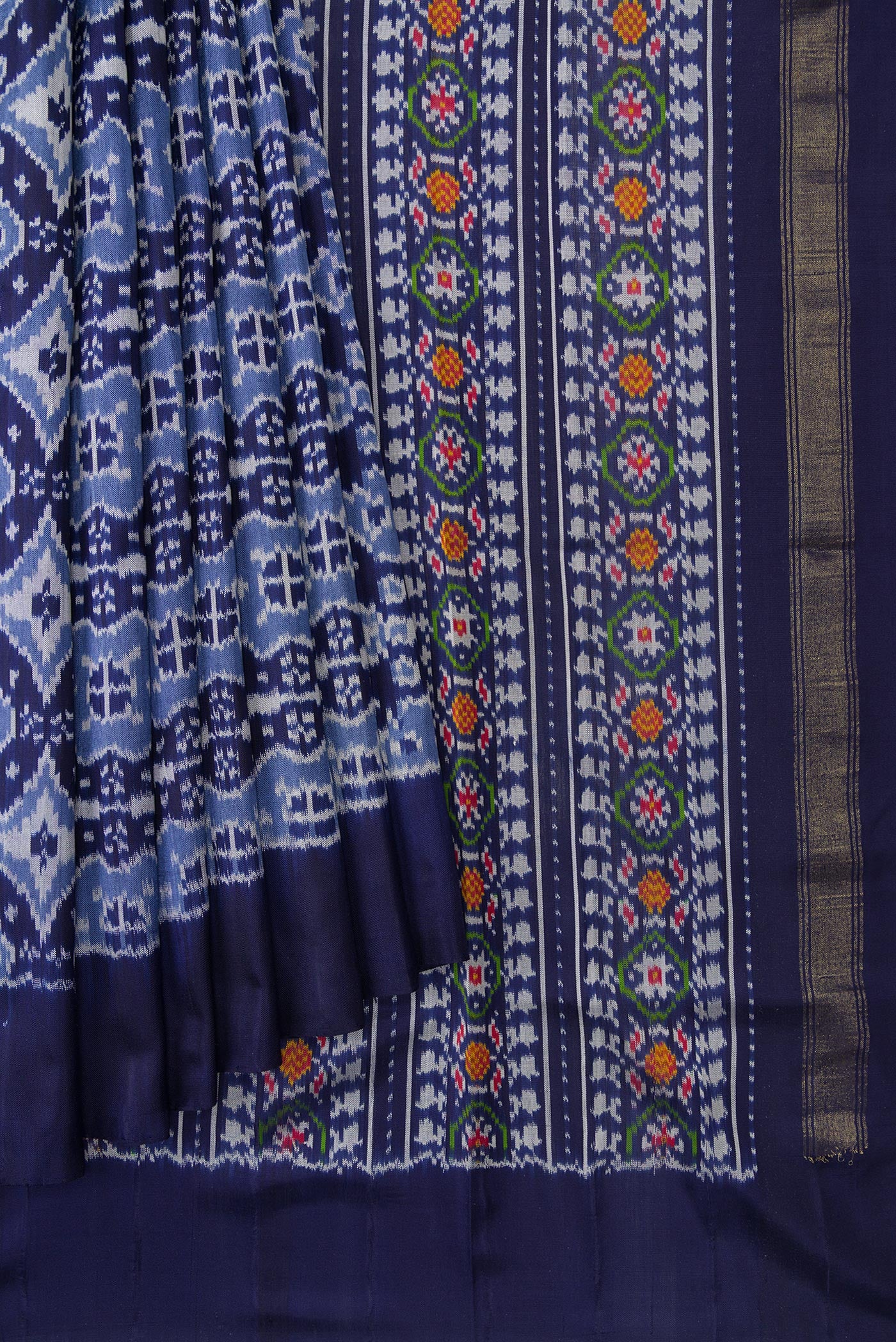 Pleats and pallu of Navy Blue Dual Tone Double Ikat Saree with Ikat Print on the body and Plain Border. 