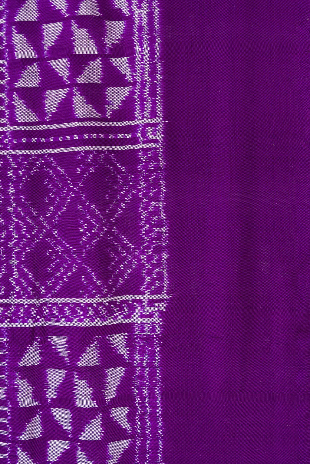 Border image of Violet Dual Tone Double Ikat Saree with Ikat Print on the body and Plain Border. 