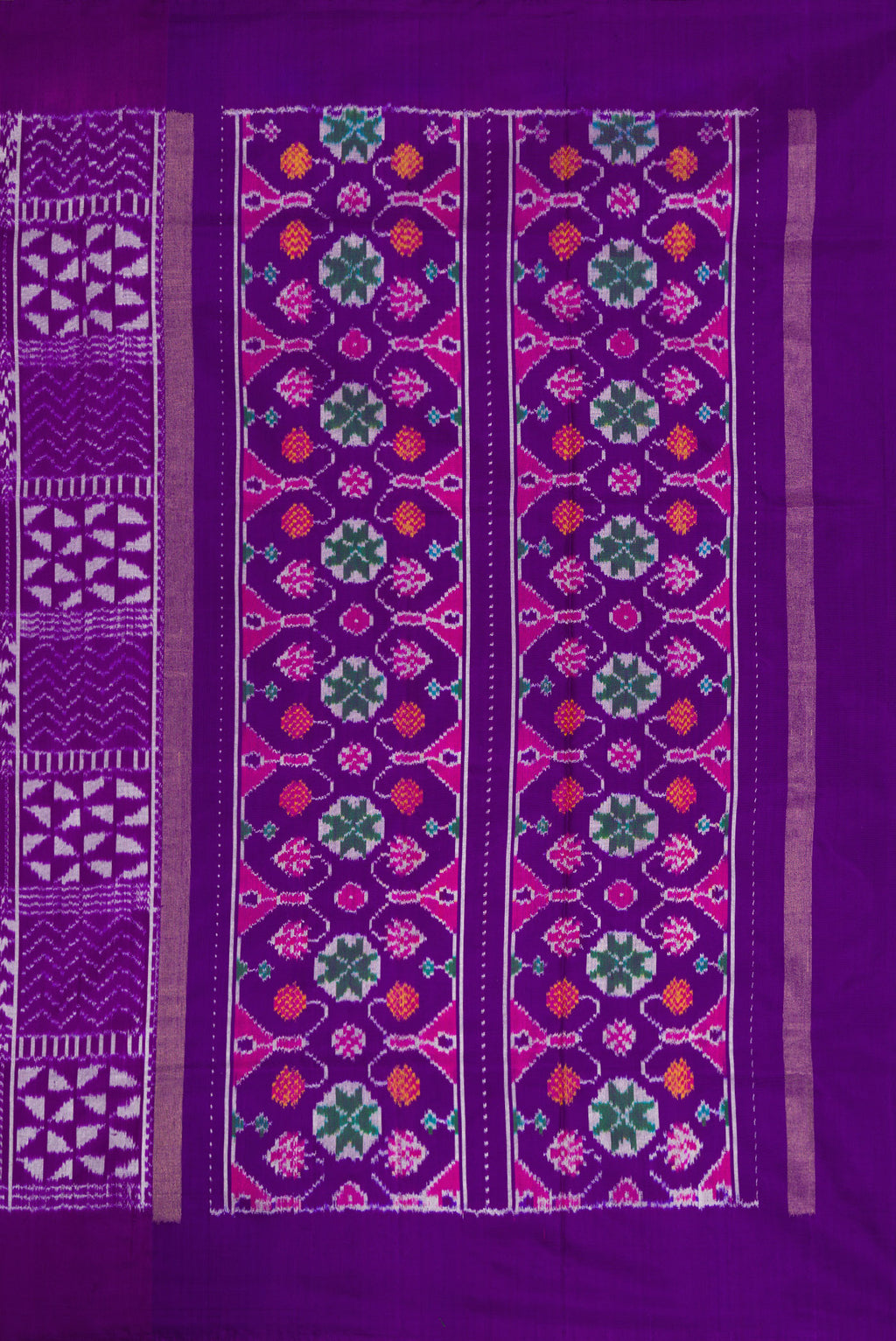Close up image of the pallu of Violet Dual Tone Double Ikat Saree with Ikat Print on the body and Plain Border. 