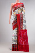 Off White Dual Tone Double Ikat Saree with Ikat Print on the body and Ikat Border.  displayed on a mannequin