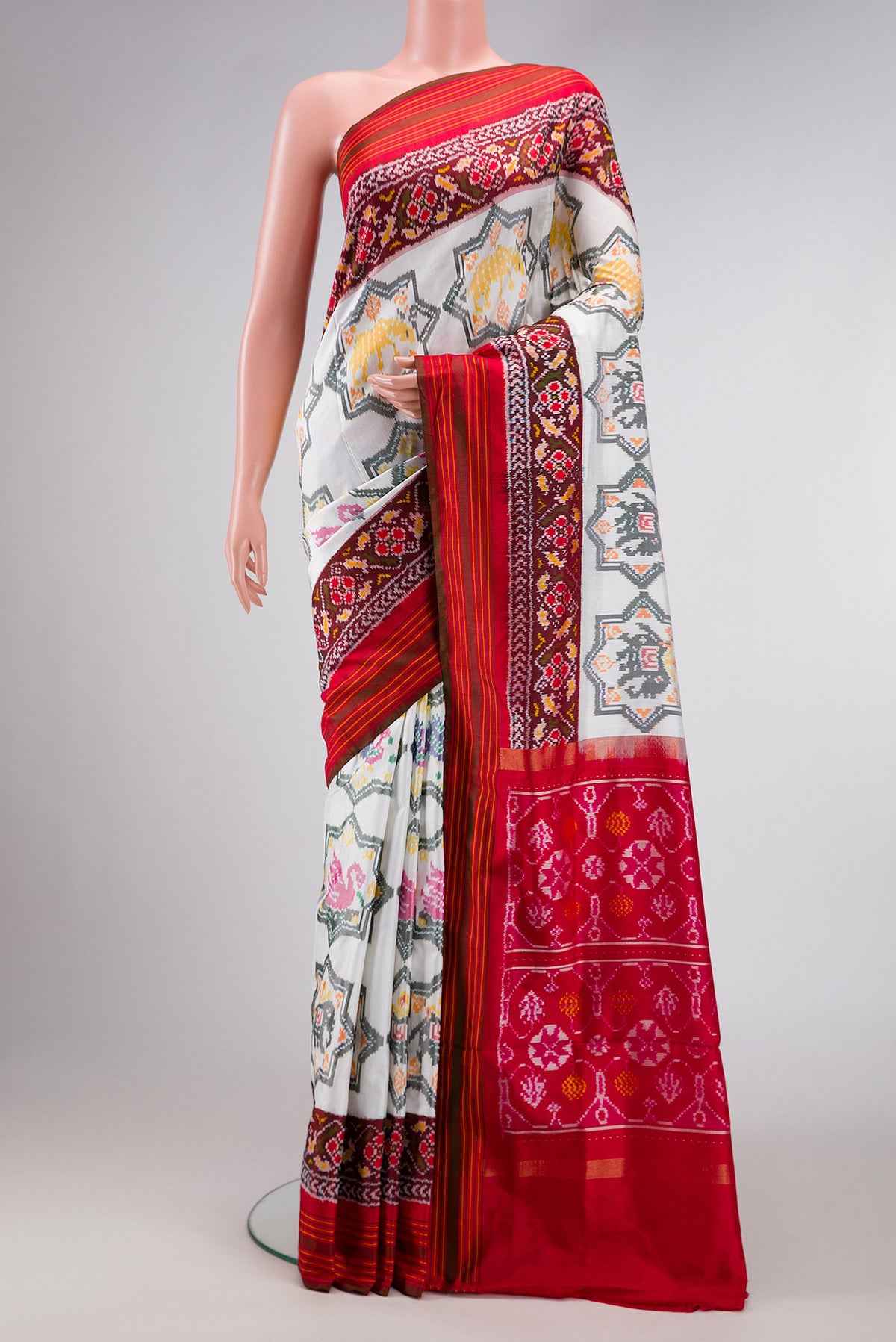 Off White Dual Tone Double Ikat Saree with Ikat Print on the body and Ikat Border.  displayed on a mannequin
