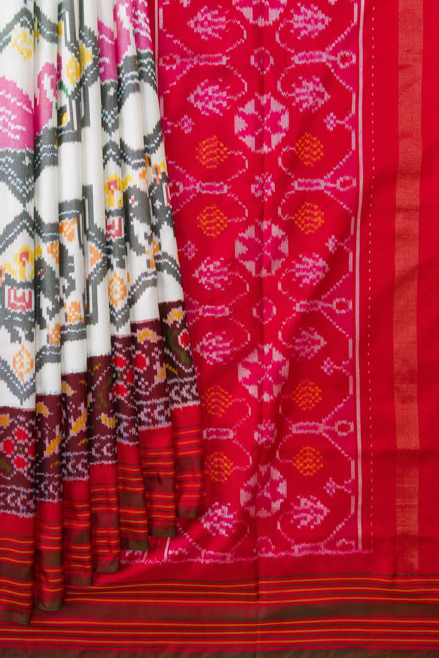 Pleats and pallu of Off White Dual Tone Double Ikat Saree with Ikat Print on the body and Ikat Border. 