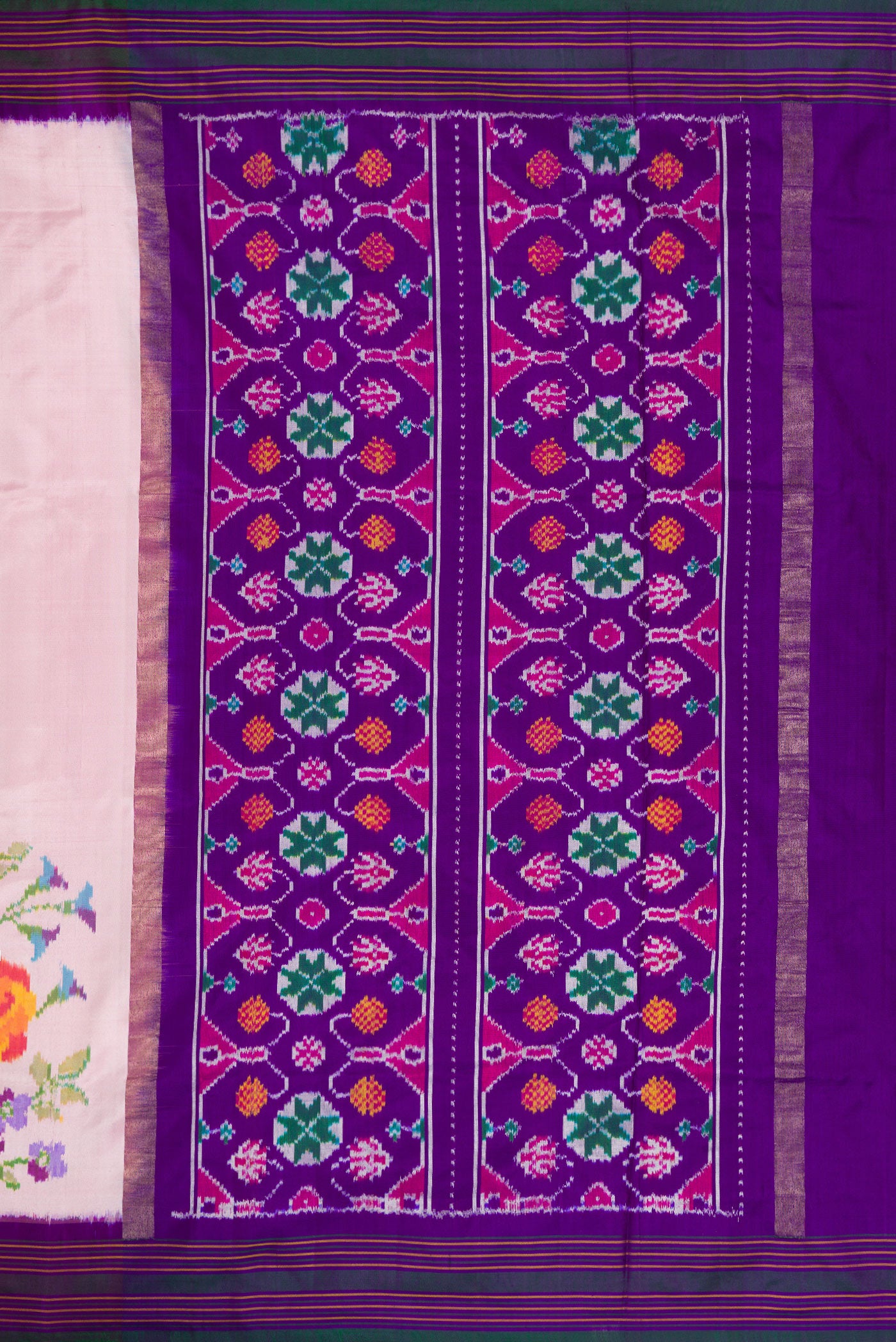 Close up image of the pallu of Pink Dual Tone Double Ikat Saree with Plain Body and Ikat Border. 