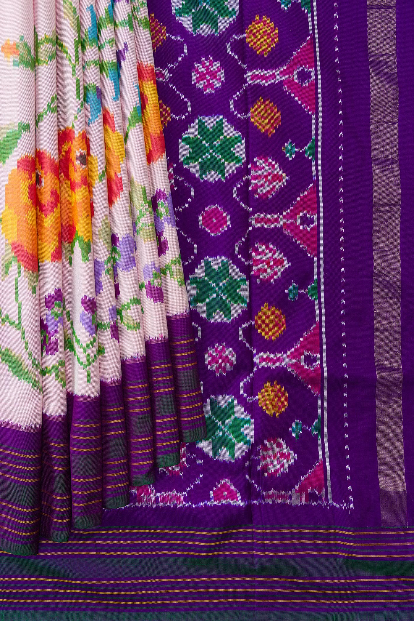 Pleats and pallu of Pink Dual Tone Double Ikat Saree with Plain Body and Ikat Border. 