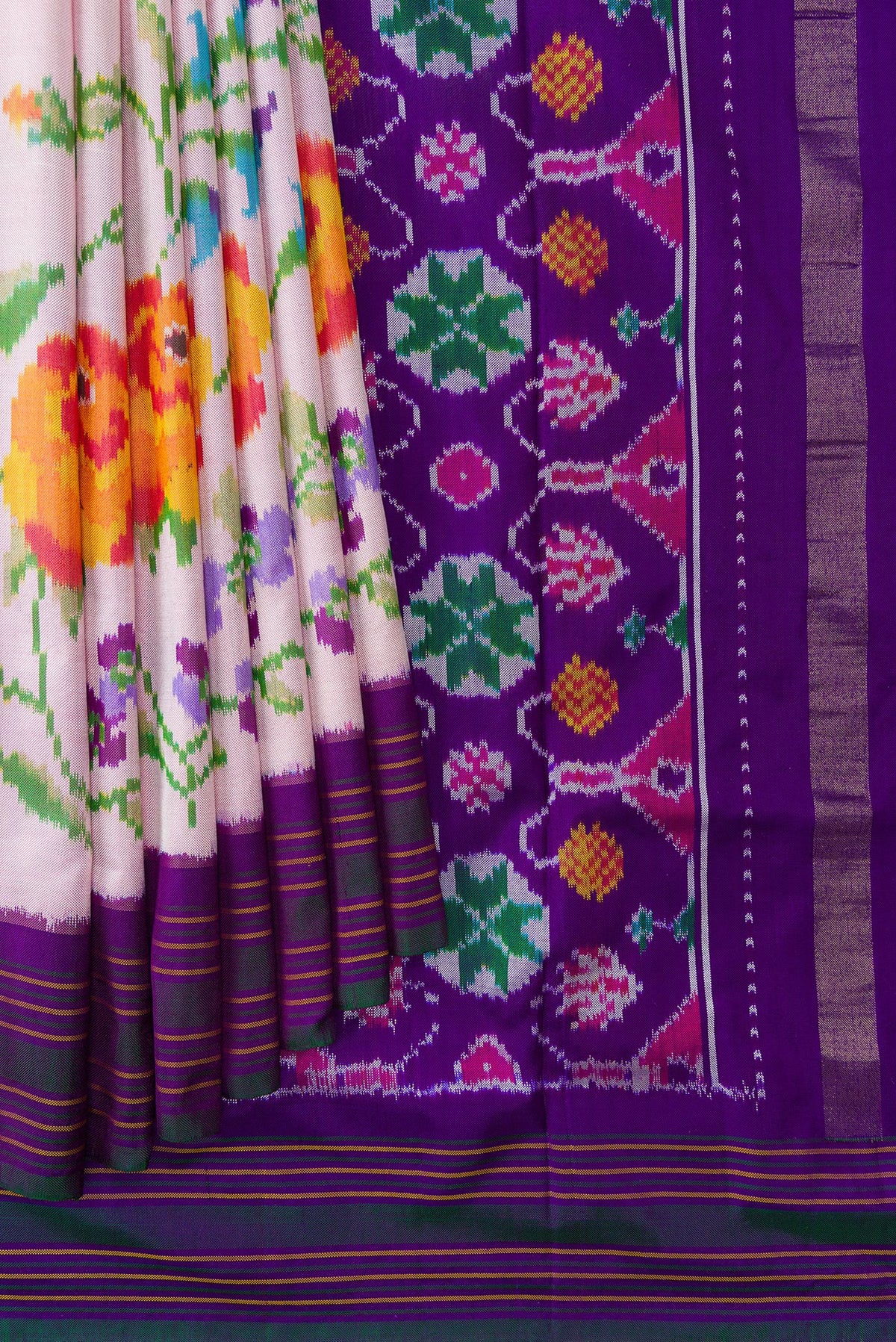 Pleats and pallu of Pink Dual Tone Double Ikat Saree with Plain Body and Ikat Border. 