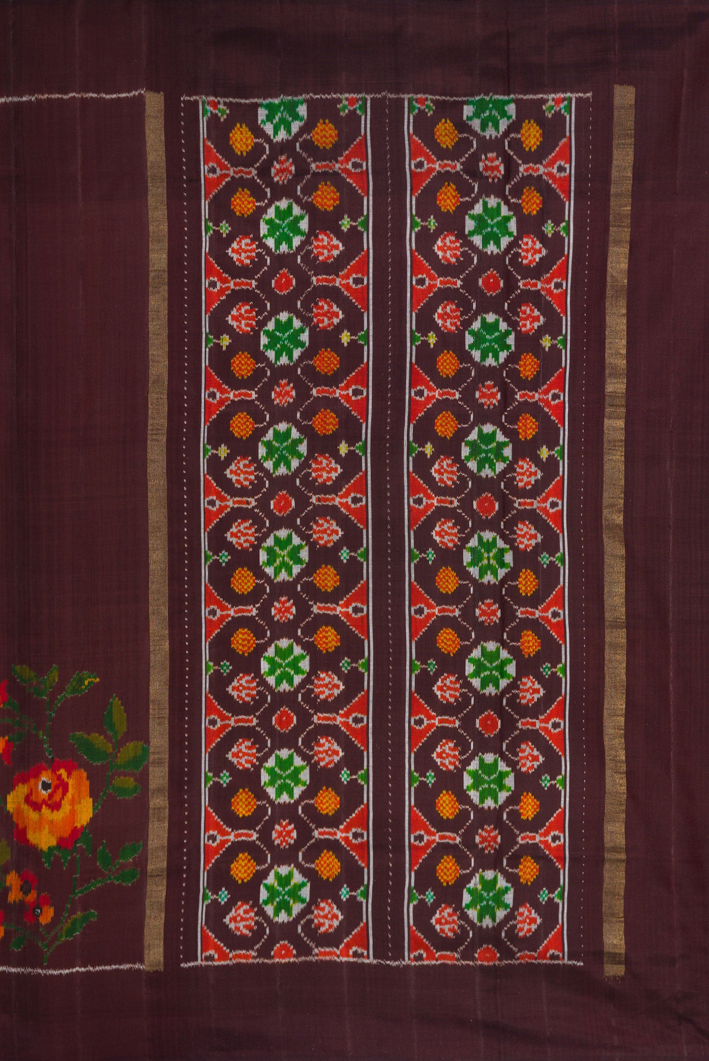 Close up image of the pallu of Brown Dual Tone Double Ikat Saree with Plain Body and Ikat Border. 